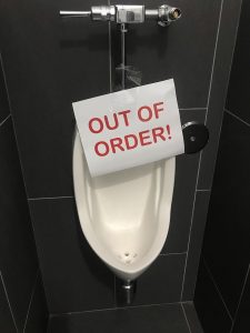 urinal is out of order, odor and slow running